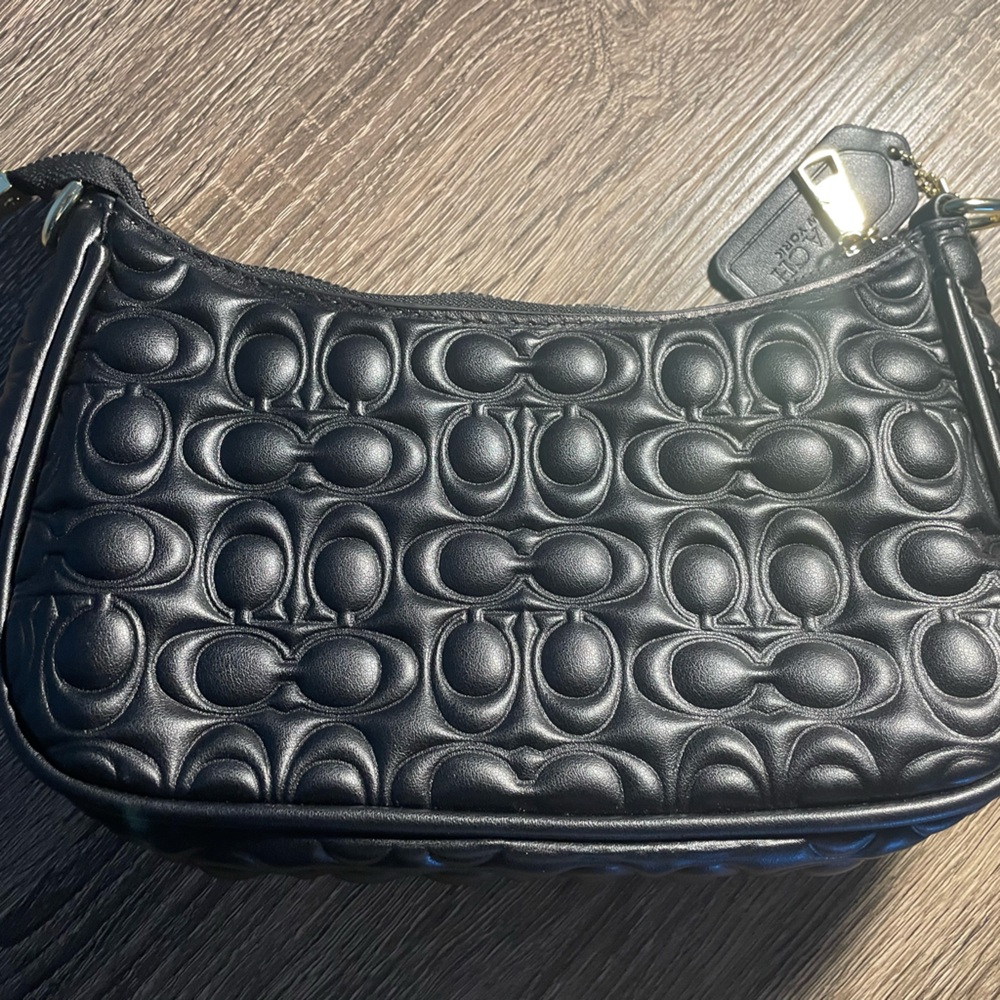 Ladies black debossed shoulder bag